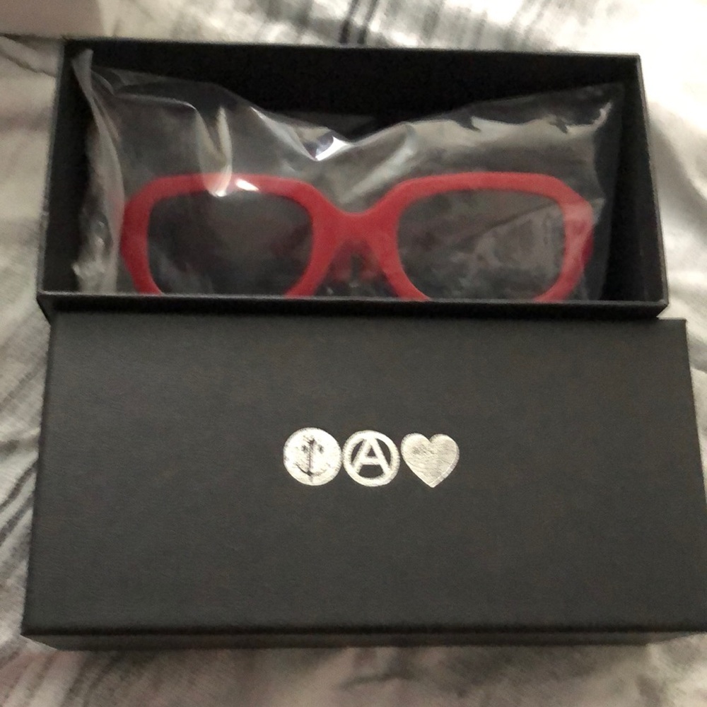 Red framed absent sunglasses